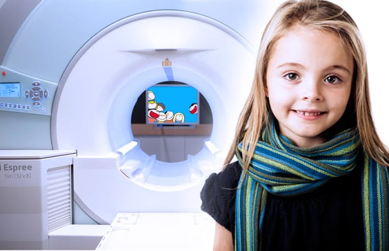 mri-scans-for-children-melbourne-radiology-clinic young girl standing infront of an MRI machine