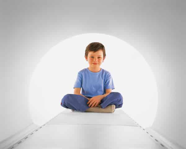 siemens-mri-wide-bore-sm11964_melbourne-radiology_04 a little boy sitting inside a wide bore MRI machine